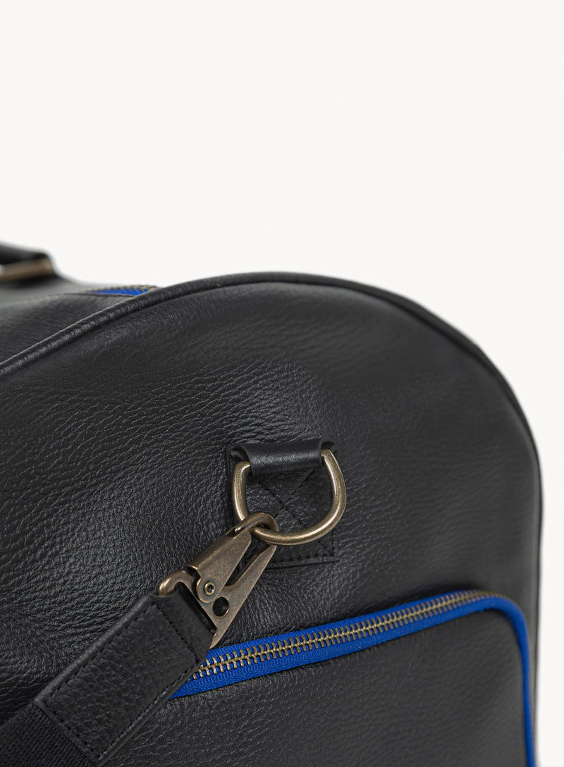 mission essential duffle bag in black close-up strap attachment.