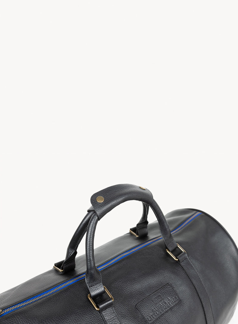 mission essential leather duffle bag handle detail.