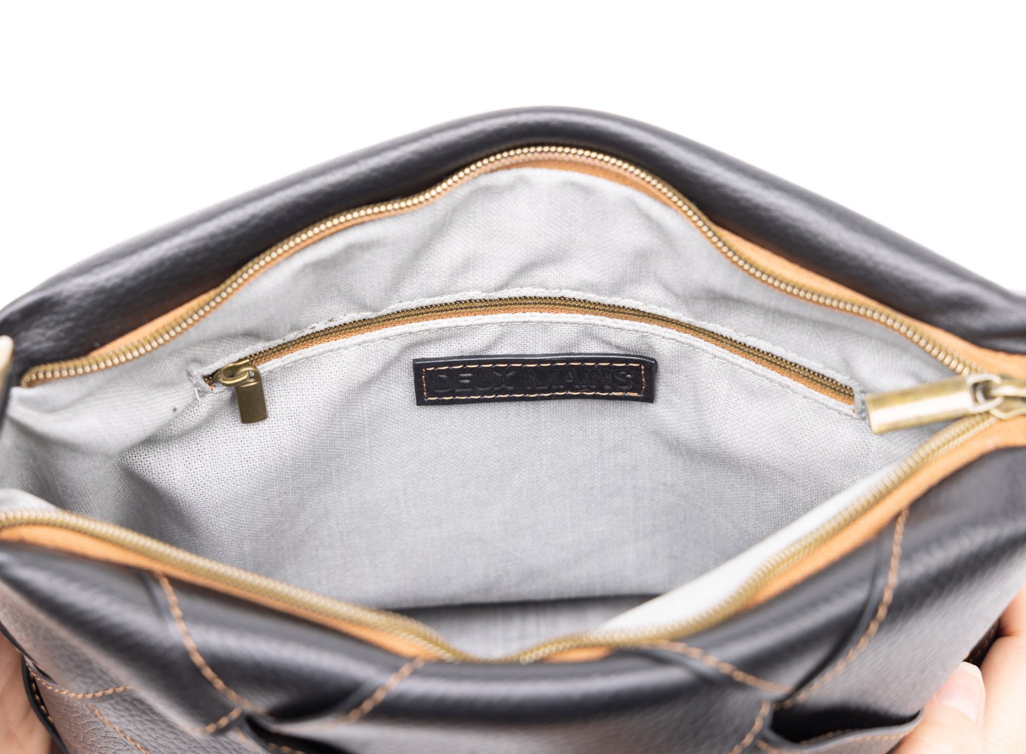 optimal shoulder bag from celeb collaboration in black showcasing internal view.