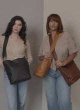 Sarah shoulder bag video of models holding handbags.