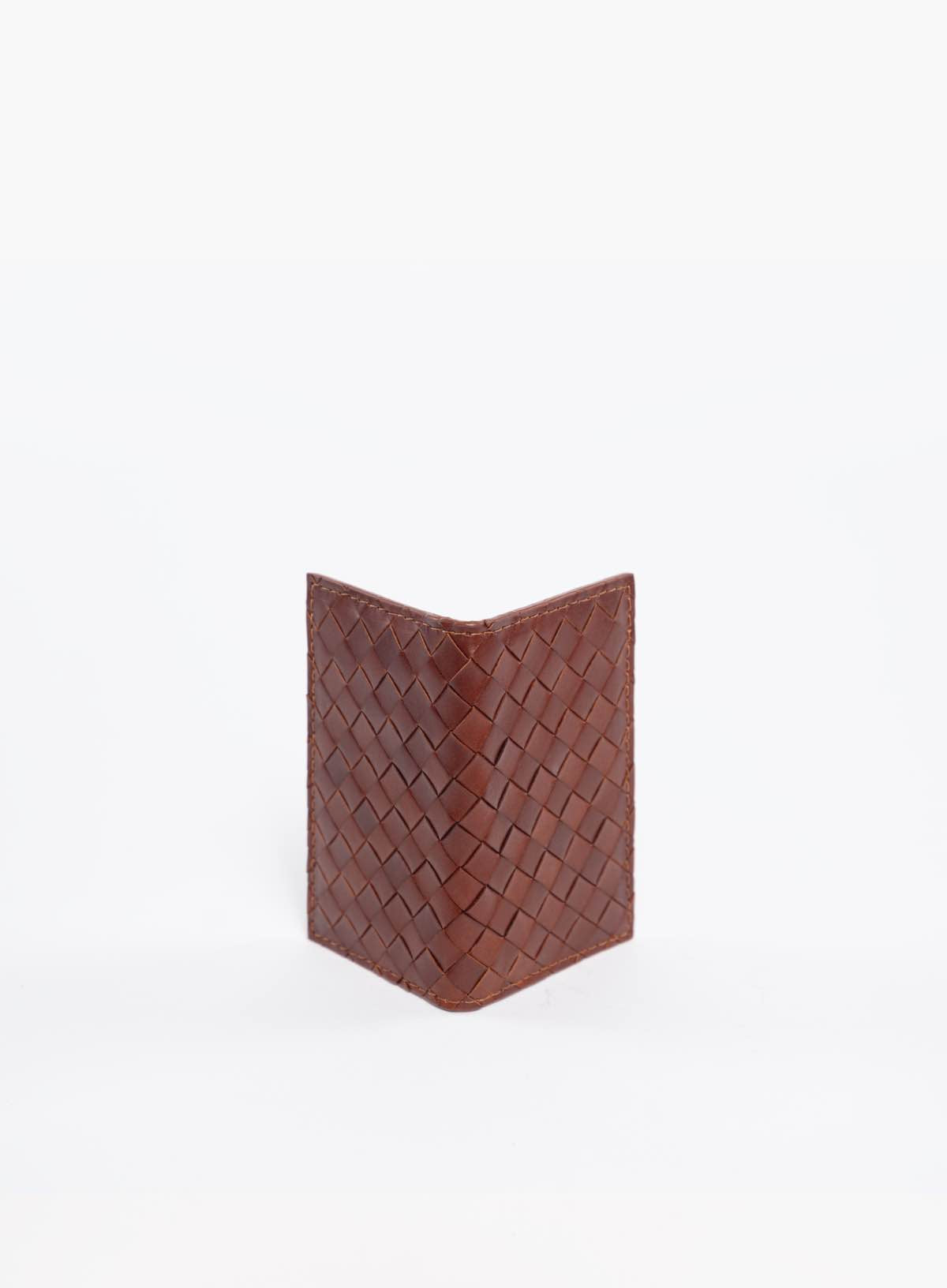 simple woven wallet  in mahogany side view from the fall collection.