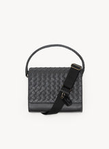 the colonel crossbody in black showcasing the front-view handle details and tag.