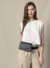 woven belt bag in black from womens bags collection on model showcasing front-view.