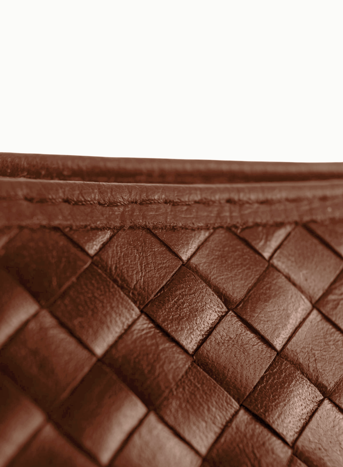 Close-up of mahogany woven leather shoulder bag, Fall/Winter collection.