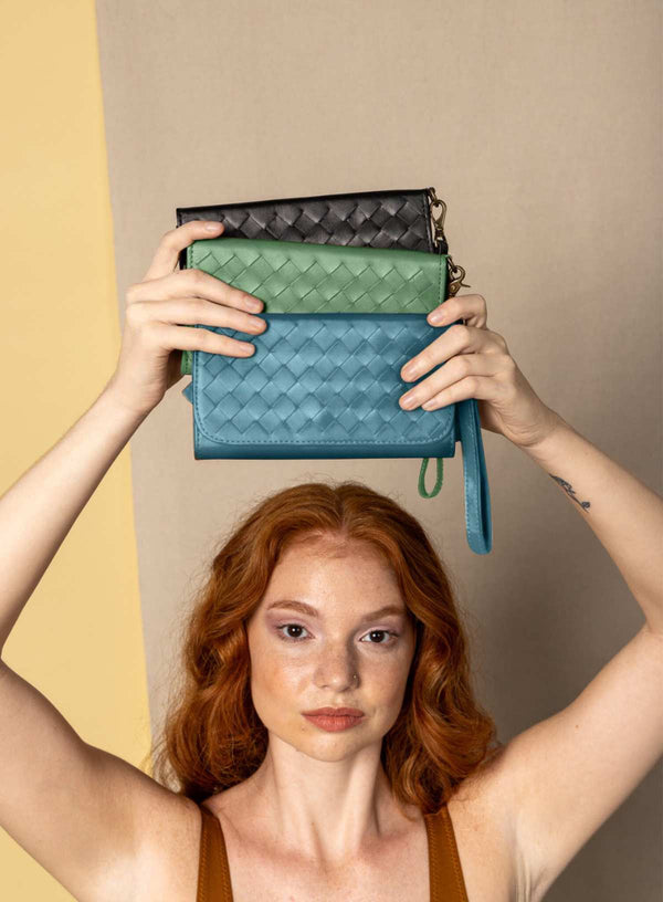 woven wristlet in blue and green from womens accessories showcasing front view.