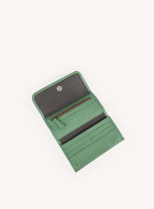 woven wristlet in sage green from womens accessories showcasing interior view.